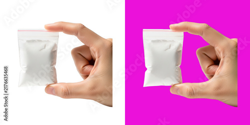 Foto Hand holding a small plastic pouch with white powder product sample transparent