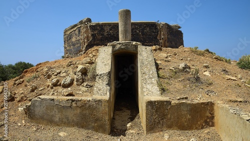 Entrance to a concrete structure on a rocky, dry hill, Lost Place, Air Defence Position, Aerophone, Parabolic Acoustic Mirror, Patella Mountain, WW2, west of Lakki, Leros, Dodecanese, Greek Islands, Greece