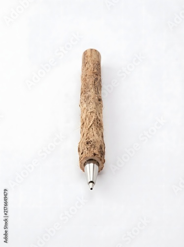Natural textured wooden ballpoint pen with steel nib for creative office stationery uses.