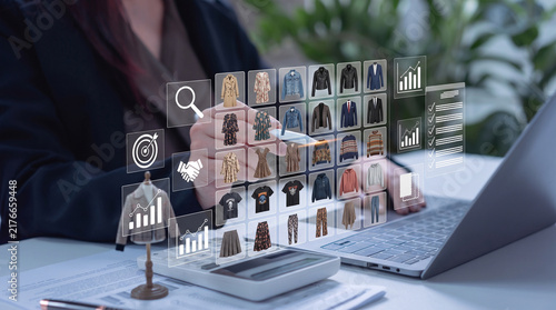 Businesswoman using digital interface for fashion retail inventory management and analytics
