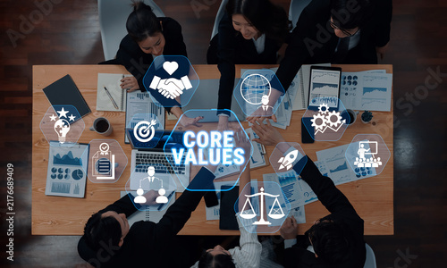 фотографія Diverse Business Team Collaborating on Core Values and Strategies in a Modern Office Setting with Digital Icons Representing Concepts of Success and Ethics Fluxor