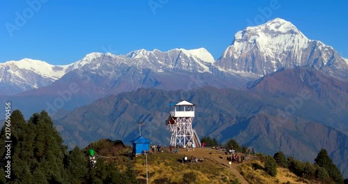 Poon Hill, Annapurna Circuit, Nepal, drone circling the tourists gathered at the summit view tower before the majestic Dhaulagiri mountain range