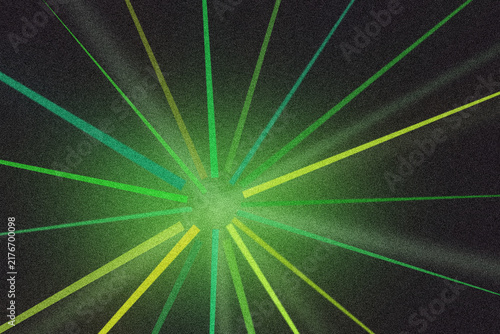 Bright green and yellow light streaks radiate from center point forming energetic visual.