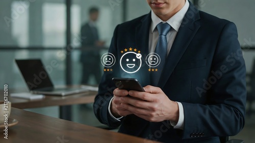 Businessman using mobile phone to give a positive customer service feedback rating