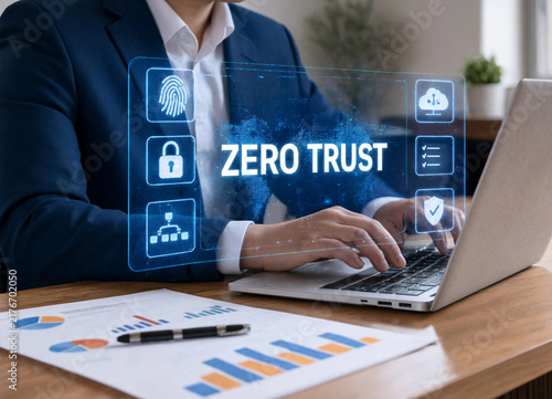 Businessman using laptop with glowing zero trust security network interface hologram transparent background