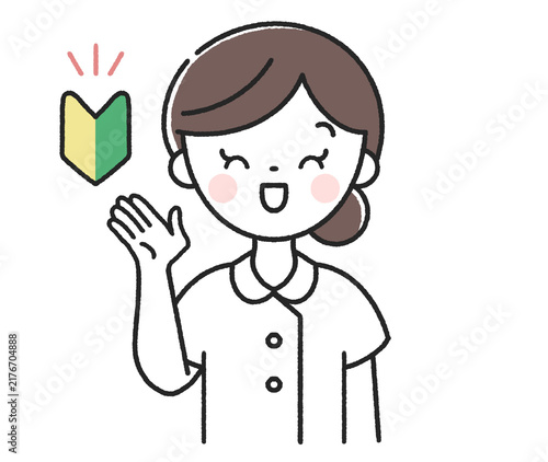 初心者マークと笑顔で案内をする女性看護師