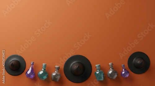 Top view of various witch hats and small glass potion bottles arranged on a vibrant orange halloween background