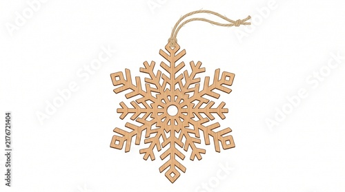 A delicate wooden snowflake ornament hanging by a twine string. 