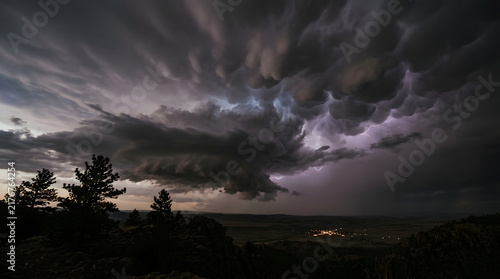 Dramatic Dark Storm Clouds Moving Fast with Lightning Flashes Background