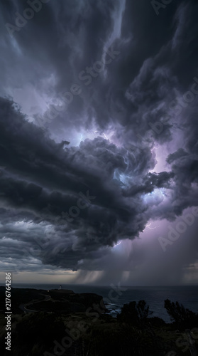 Dramatic Dark Storm Clouds Moving Fast with Lightning Flashes Background