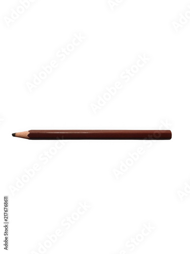 A single colored pencil in dark tones shows a sharpened tip against a deep black canvas