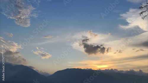 time lapse clouds over the mountains at sunset
