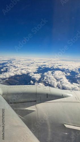 Flying an airplane above the clouds