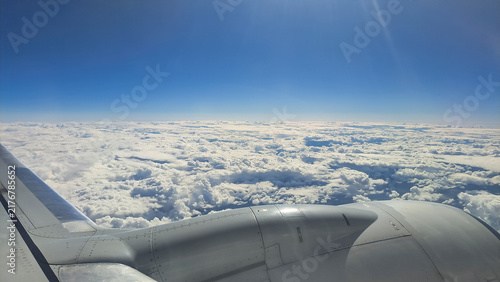 Flying an airplane above the clouds