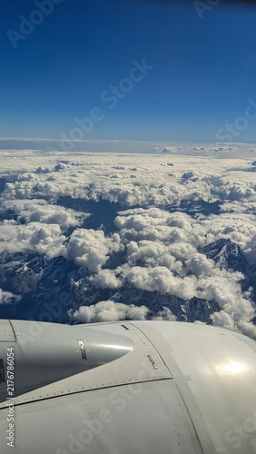 Flying an airplane above the clouds