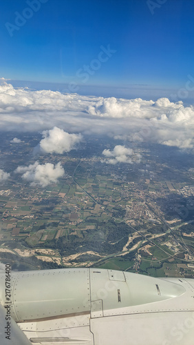 Flying an airplane above the clouds