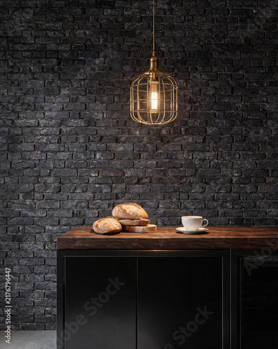 Dark industrial kitchen with black metal frame and warm pendant lights