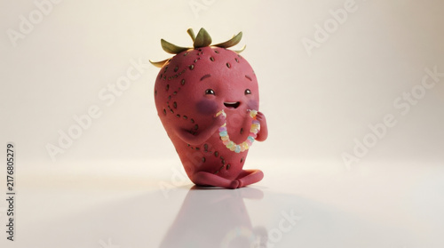 Cute anthropomorphic strawberry figure sitting while holding colorful round candy bead necklace against plain neutral backdrop studio.