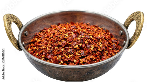 Crushed red chili pepper flakes in a metal bowl isolated on transparent background