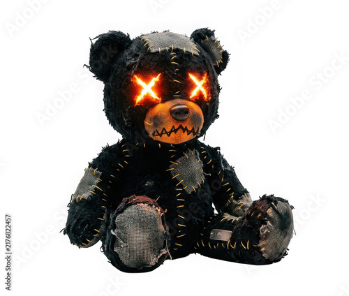 Scary black teddy bear with glowing orange x eyes isolated on transparent background