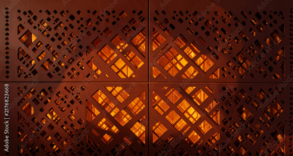 Obraz premium Perforated Copper Exterior Facade Geometric Diamond Cutout Panel