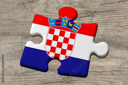 3D illustration. Flag of Croatia on a jigsaw puzzle pieces on a wood background.