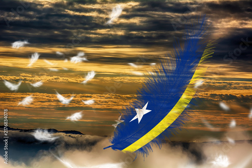 3D illustration. Flag of Curacao on a feathers fluttering in the sky background.