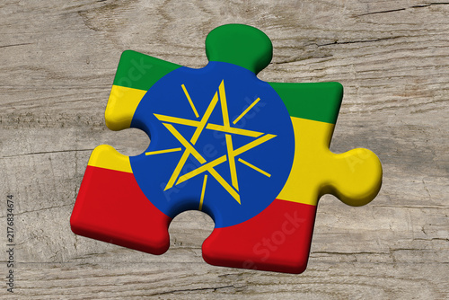 3D illustration. Flag of Ethiopia on a jigsaw puzzle pieces on a wood background.