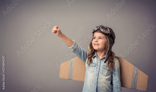 Young Girl Explorer with Cardboard Wings