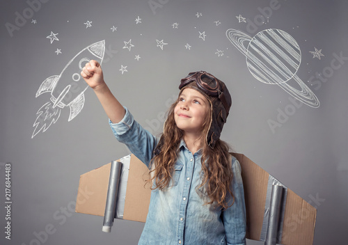 Young Girl Astronaut Pretending to Explore Space