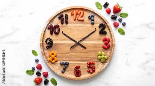 Creative Clock Face Made of Various Fresh Berries and Fruits on Wooden Plate