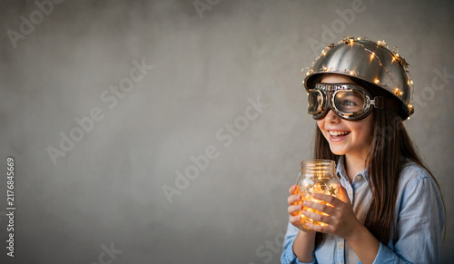Young Scientist Holding Glowing Flask