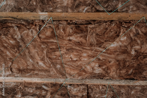 Fotografie Building insulation with visible mold on wooden beams