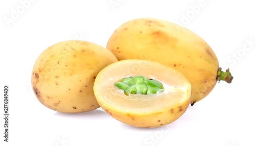 Freshly sliced lemon garnish on white plate.