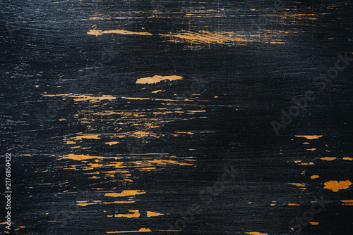 Canvastavla Distressed black wood texture with worn golden undertones