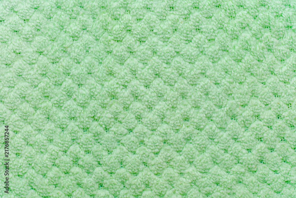 Obraz premium Soft textured fabric surface with light green hue