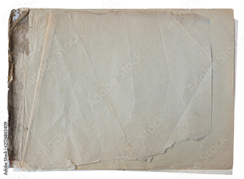 Stack of aged translucent paper sheets with torn edges and a damaged binding isolated on a white background