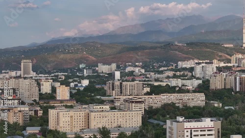  A picturesque drone view of the Kazakh city of Almaty at sunset on a summer evening.