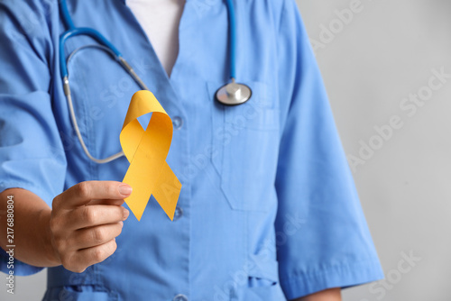 Foto Suicide prevention and mental health awareness, nurse holding yellow ribbon for