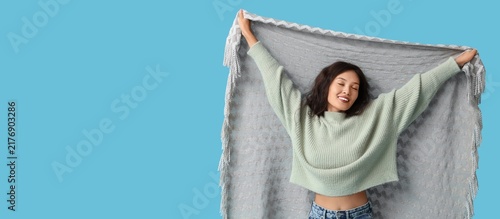 Принти на полотні Comfort and relaxation, happy young woman wrapped in a soft cozy blanket feeling