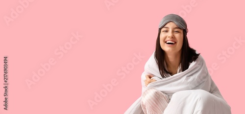 Quadro su tela Sleep quality and wellness, happy young woman wearing eye mask wrapped in white