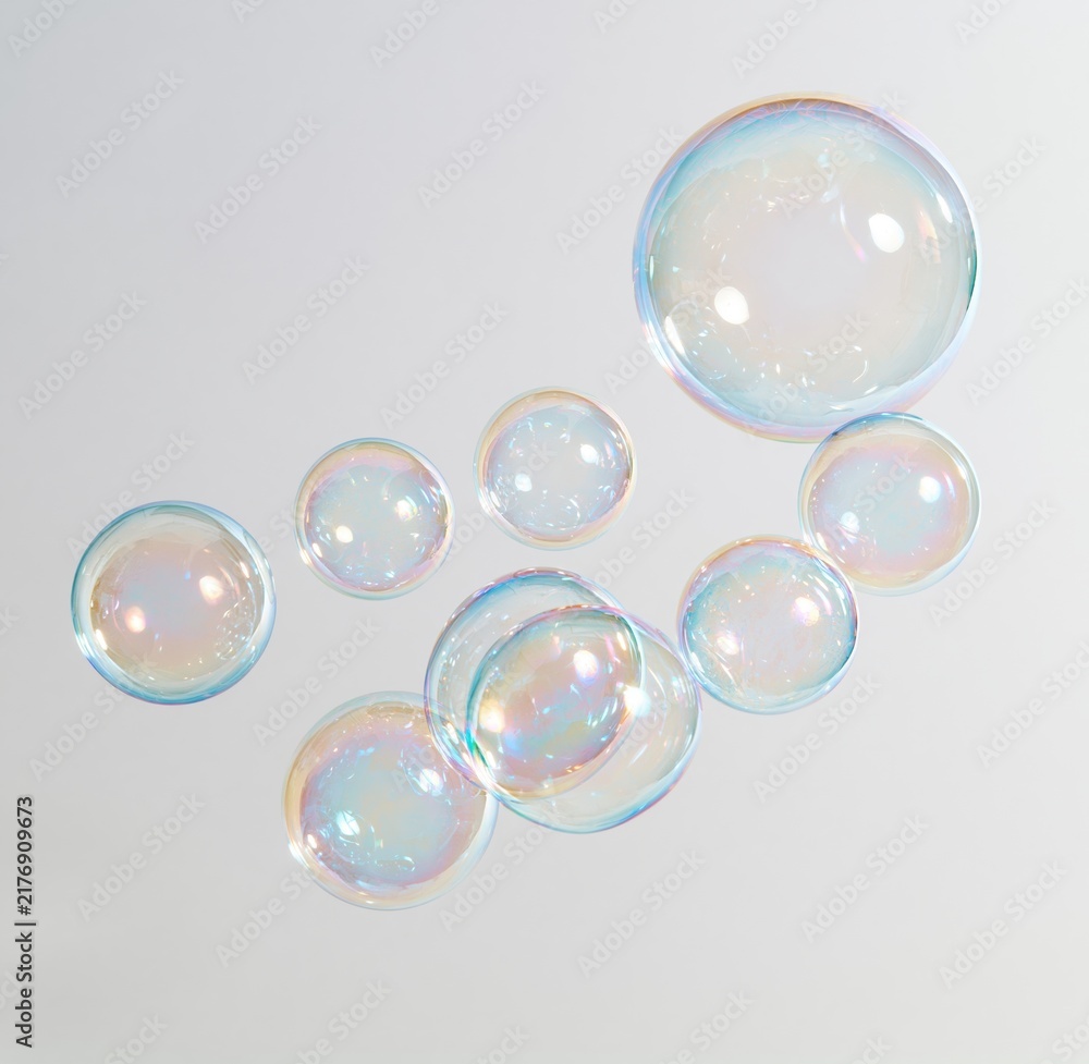 Obraz premium Colorful iridescent soap bubbles floating against white background