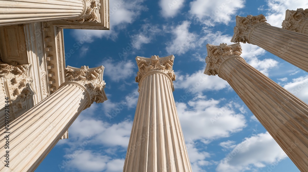 Obraz premium Tall ornate stone columns reach up towards blue