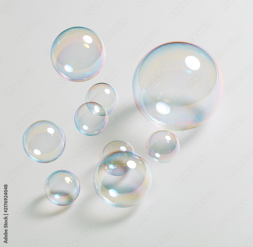 Obraz premium Colorful soap bubbles floating on white background