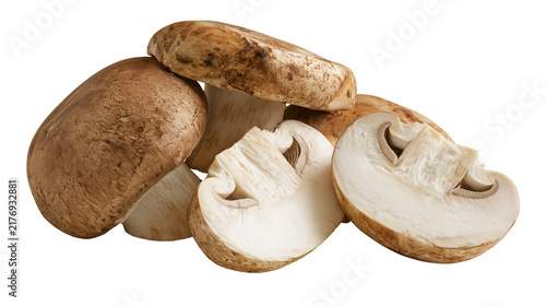 Whole and sliced brown cremini mushrooms with visible gills and earthy texture