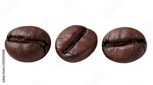 Принти на полотні Three roasted dark brown coffee beans arranged in a row
