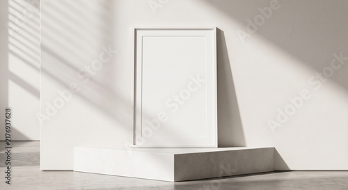 Vertical mockup poster frame standing on concrete podium against white wall with sunlight shadows for modern interior design presentation
