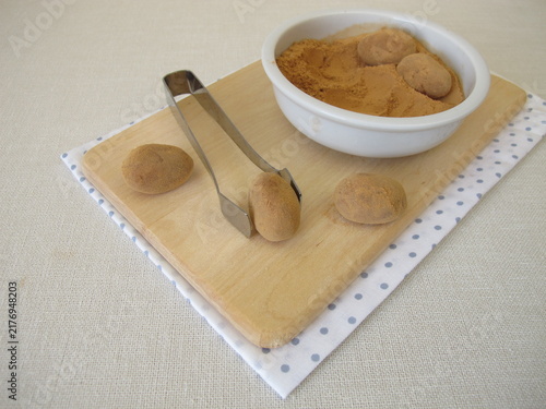 Homemade marzipan potatoes or marzipan eggs with low-histamine carob powder as a substitute for cocoa