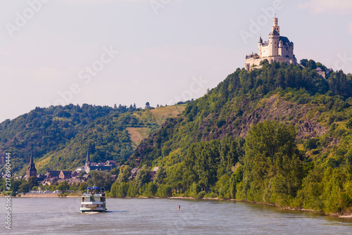 Germany, Rhineland-Palatinate, Upper Middle Rhine Valley, Braubach, View of Castle Marksburg at Rhine river and tourist boat