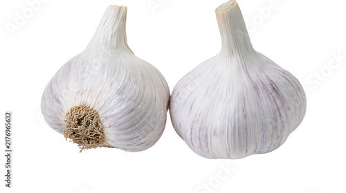 Two fresh whole garlic bulbs with papery white skin and fibrous roots